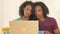 Calm black couple sitting at desk