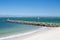 Calm blue ocean waters with rocky coast of Dolls Point Beach, Brighton Le Sands, Sydney, Australia.