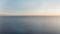 Calm blue sea and clear sky at sunset panoramic aerial view