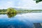 Calm blue water Ross Lake, Killarney at sunrise.