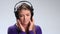 Calm brunette woman enjoying music in headphones