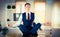 Calm businessman meditating in lotus pose