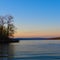 Calm Cayuga Lake near Ithaca at sunrise