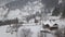 Calm and cosy fairy-tale village Kryvorivnia covered with snow in the Carpathians mountains, aerial view