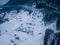 Calm and cosy fairy-tale village Kryvorivnia covered with snow in the Carpathians mountains, aerial view. Typical landscape in