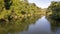 Calm Country Creek With Water Reflections