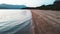 Calm and deserted tropical beach, with natural vegetation, without people.