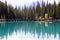 Calm Emerald Lake reflecting the trees in National Park, British Columbia, Canada