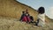 Calm family spend time together on sea beach. Happy people taking photos outside