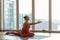 Calm female yogi showing her flexibility