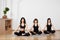 Calm fitness women resting while sitting and meditating in lotus asana. Yoga classes in gym. Easy yoga asana. Copy space