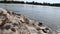 Calm floating big river with stones and rocks and a natural environment with clear water and tranquil scenery meditative hiking