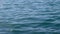 Calm, gentle waves on ocean in summer. Slow motion. Close up.