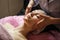 Calm girl having spa facial massage in luxurious beauty salon