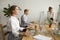 Calm happy businesswoman meditating at office desk working with