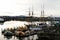 A calm harbor in Victoria with water-taxis and old sailing ships