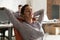 Calm Indian businesswoman employee relaxing in comfortable office chair