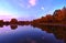 Calm lake in the fall sunset