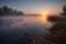 calm lake with misty sunrise, bringing new day