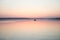 Calm lake sunset boat couple minimalism