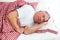 Calm mature man sleeps in bed