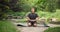 Calm mindful young african american man meditating doing exercise practicing yoga breathing for peaceful mind and zen