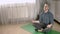 Calm mindful young man meditate in his living room