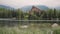 Calm mountain lake touristic hotel on lakeside