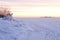 Calm northern snowscape with beautiful winter sunrise