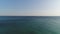 Calm open sea or ocean, aerial view. Seascape against the sky