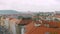 Calm panoramic view of red roofs of old buildings in ancient areas of Prague