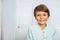 Calm positive portrait of little boy at home smile