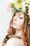 Calm pretty girl with snail and flower crown