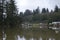 A calm reflection by the river houses and docks