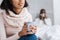 Calm relaxed woman sitting with a cup of hot drink