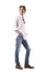 Calm relaxed young casual man in jeans looking back over shoulder with hands in pockets.