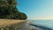 Calm and relaxing aerial drone image of a stunning beautiful hidden remote ocean sea shore at sunset with an endless sandy beach