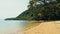 Calm and relaxing aerial drone image of a stunning beautiful hidden remote ocean sea shore at sunset with an endless sandy beach