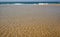 Calm ripples on the water surface at a beach