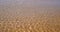 Calm ripples on the water surface at a beach