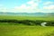 Calm river curving through a picturesque valley surrounded by high hills