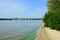 Calm river with green riverbank