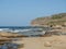Calm rocky beach captured on a sunny day in Crete, Greece