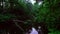 Calm scenic river with duckweed and reeds in a forest.