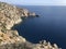 Calm sea and bend of sea rocky coastline