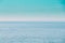 Calm Sea Ocean And Blue Clear Sky Background. Gently Blue Color