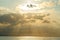 Calm sea with sunset sky and sun through the clouds over. Meditation ocean and sky background. Tranquil seascape