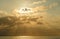 Calm sea with sunset sky and sun through the clouds over. Meditation ocean and sky background. Tranquil seascape