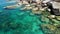 Calm sea water near stones. Peaceful blue sea water and gray boulders in perfect place for snorkeling on Koh Tao Island on sunny