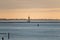 Calm seascape view with windmills on the horizon in Norderney, German